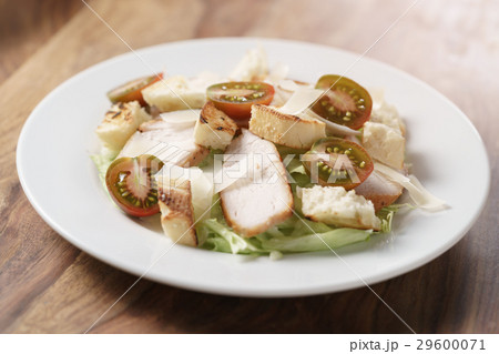caesar salad with cherry kumato tomatoes on wooden caesar salad with cherry kumato tomatoes on wooden 29600071