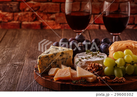 Cheese, nuts, grapes and red wine Cheese, nuts, grapes and red wine 29600302
