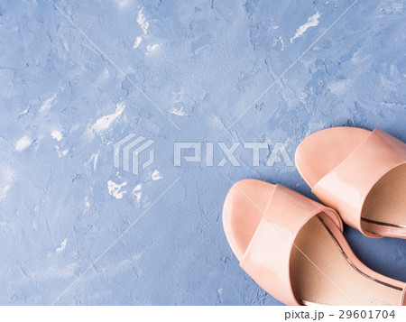 Pair of woman pink sandals on blue background 29601704