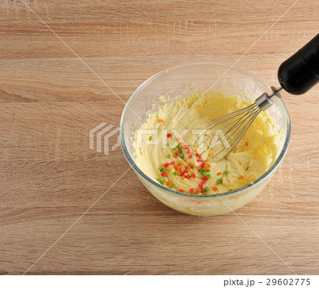 mixing dough for cake in a bowl with candied fruit 29602775