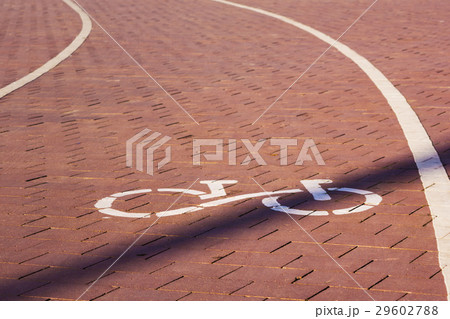 Bike path sign. Path paved with cobblestones. Bike path sign. Path paved with cobblestones. 29602788