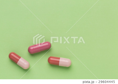 Three brown medicine capsules Three brown medicine capsules 29604445