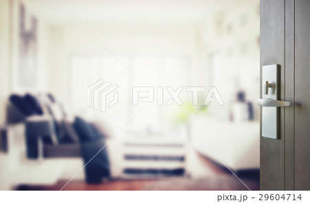 opened wooden door to modern bedroom interior 29604714
