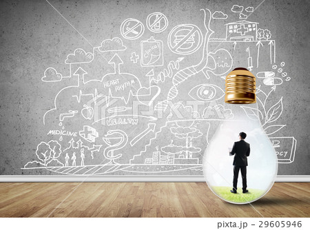 Businessman trapped in bulb Businessman trapped in bulb 29605946