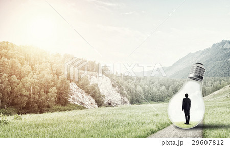 Businessman inside light bulb 29607812