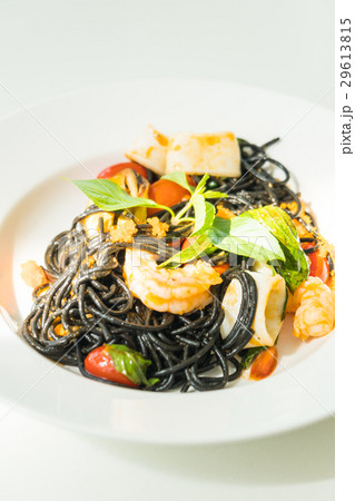 Black Spaghetti with seafood in white plate 29613815
