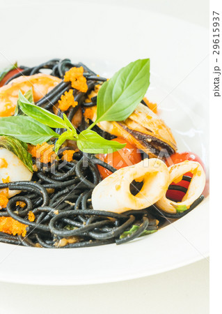 Black Spaghetti with seafood in white plate Black Spaghetti with seafood in white plate 29615937