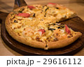 Delicious seafood pizza on a wooden textured table 29616112