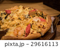 Delicious seafood pizza on a wooden textured table 29616113