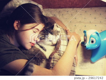 teen girl hug cuddle cat in bed teen girl hug cuddle cat in bed 29617242