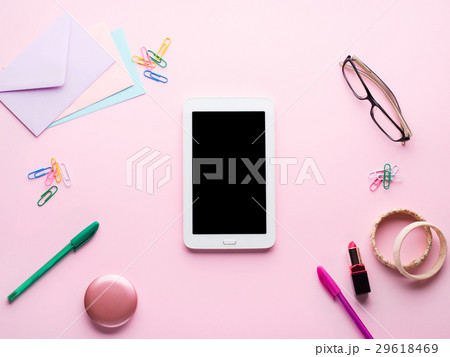 Pink flat lay with gadget stationery lipstick