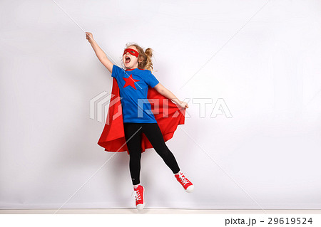 Six year blonde girl dressed like superhero having 29619524