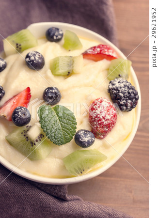 Bowl of semolina dessert with berries Bowl of semolina dessert with berries 29621952