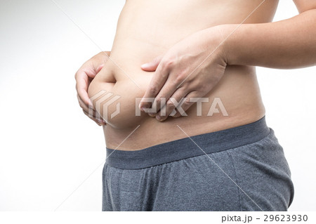 overweight man with hand holding fat belly 29623930