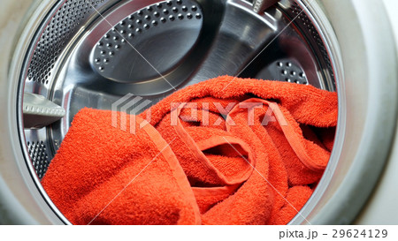 Washing drying machine with red towel in laundry Washing drying machine with red towel in laundry 29624129