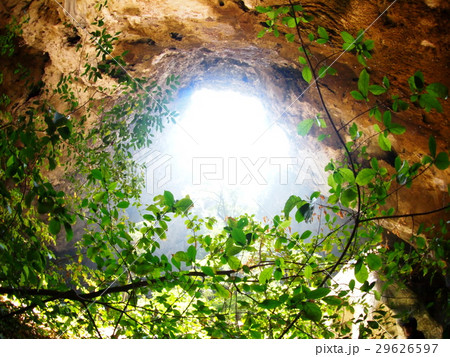 sun light beam through cave hole crop view 29626597