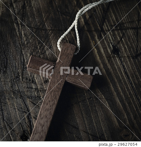 wooden cross with a cord 29627054