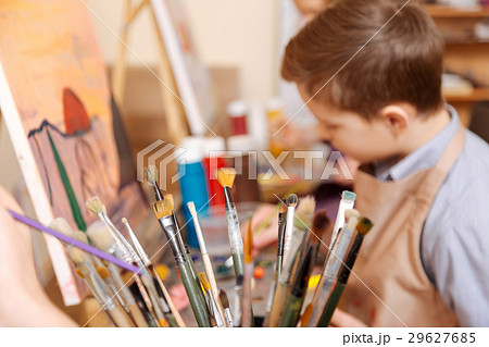 Diligent boy having art class in the school Diligent boy having art class in the school 29627685