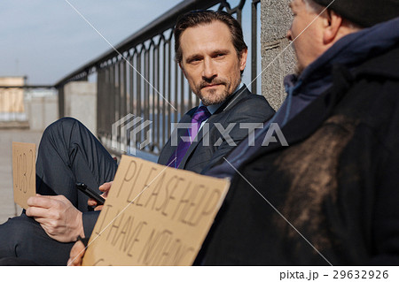 Serious bearded man looking at homeless Serious bearded man looking at homeless 29632926