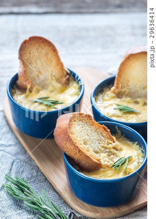Bowls of onion soup on the wooden board 29636414