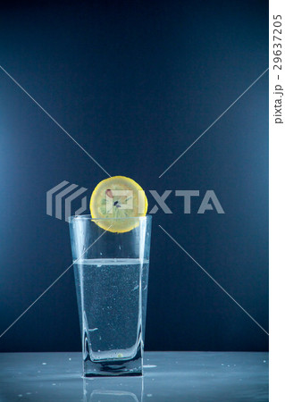 slice of lemon drops in a glass of water slice of lemon drops in a glass of water 29637205