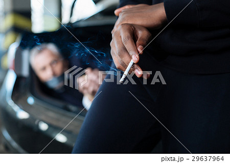 Selective focus of a cigarette being smoked 29637964