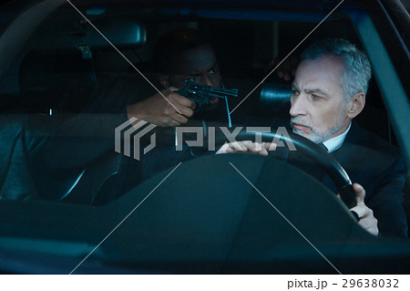 Nice pleasant man having a criminal in his car Nice pleasant man having a criminal in his car 29638032