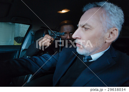 Cheerless worried man sitting in his car Cheerless worried man sitting in his car 29638034