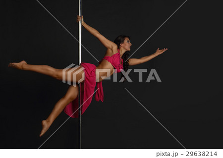 Woman performing pole dance Woman performing pole dance 29638214