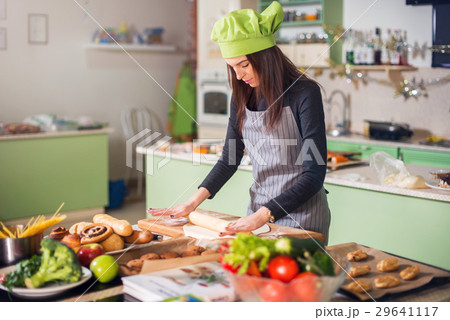 Young woman in casual clothes, apron and hat Young woman in casual clothes, apron and hat 29641117