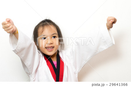 Asian girl is practicing Taekwondo on white Asian girl is practicing Taekwondo on white 29641366