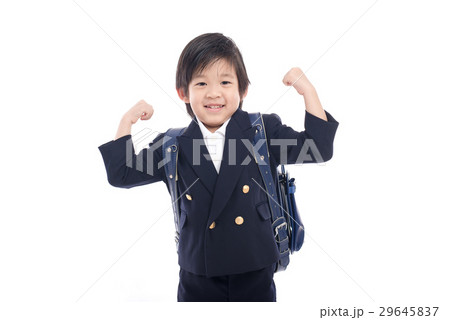 Asian child in school uniform with blue school bag Asian child in school uniform with blue school bag 29645837
