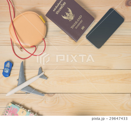 Air travel accessories flat lay on wood with copy Air travel accessories flat lay on wood with copy 29647433