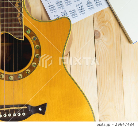 Guitar with Musical notebook for song writing. 29647434