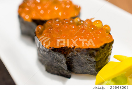 Ikura Salmon eggs sushi closed up on white plate 29648005