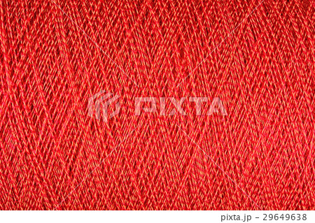 Spool of orange thread macro background Spool of orange thread macro background 29649638