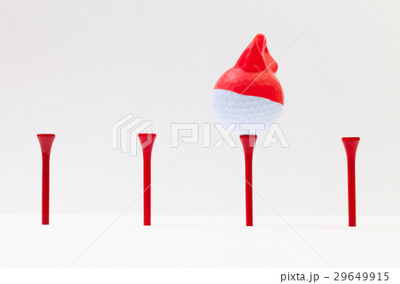 White golf balls with funny cap.  29649915