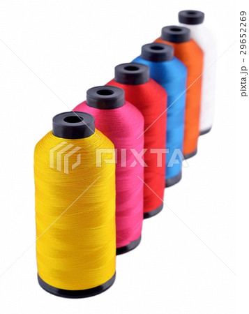 Spools of threads on a white 29652269
