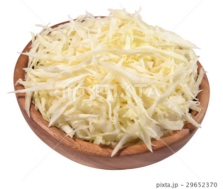 Chopped white cabbage in a wooden bowl on a white 29652370