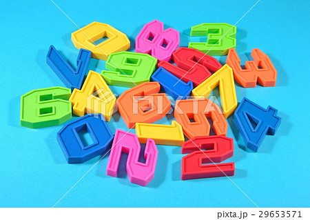 Plastic colored numbers on a blue background 29653571