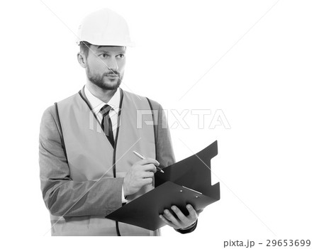 Male architect in a safety west and a hardhat Male architect in a safety west and a hardhat 29653699