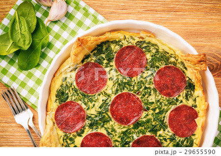 Tart with spinach and slices of salami. Tart with spinach and slices of salami. 29655590