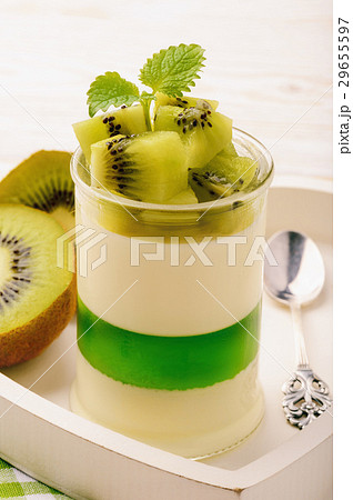Panna cotta with kiwi jelly and kiwi fruits. Panna cotta with kiwi jelly and kiwi fruits. 29655597