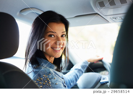 Woman sitting in a car Woman sitting in a car 29658514