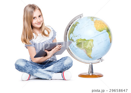 Cute little young girl with tablet and globe.  29658647