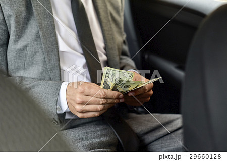 man counting dollar bills man counting dollar bills 29660128