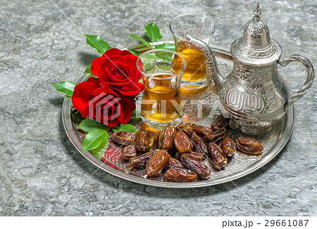 Tea, dates fruits and flowers. Islamic holidays 29661087