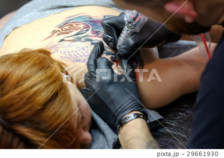 Artist is making the tattoo close up 29661930