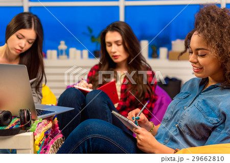 Happy african female noting in memo pad Happy african female noting in memo pad 29662810