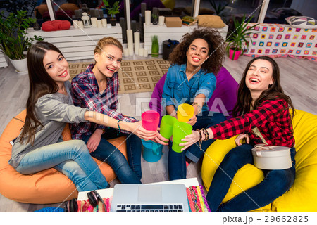 Outgoing girls drinking beverage at party Outgoing girls drinking beverage at party 29662825